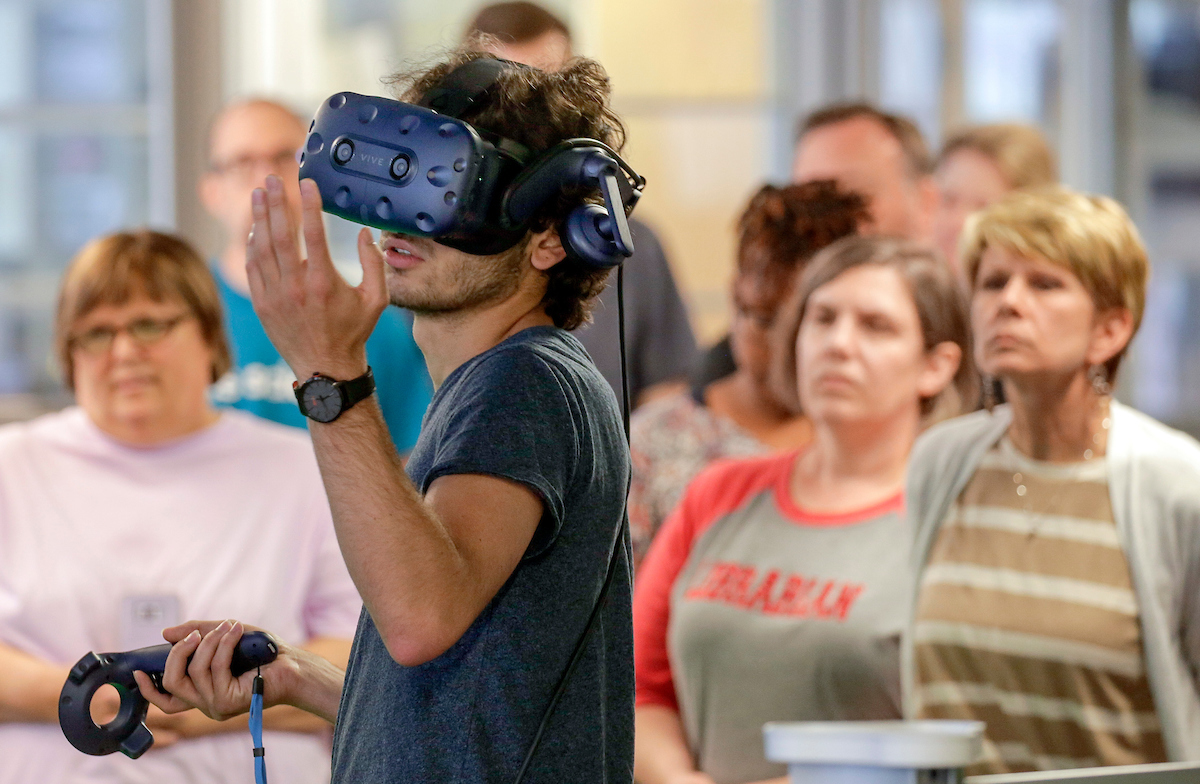 High School teachers from around the state participate in a cybersecurity workshop at UA Little Rock. A lab portion of the 3 day workshop uses virtual reality devices to visualize a cyber attack from inside a network system.
