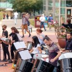 Members of the Trojan Steel Band perform on campus in hopes of collecting donations for the Percussion Club.