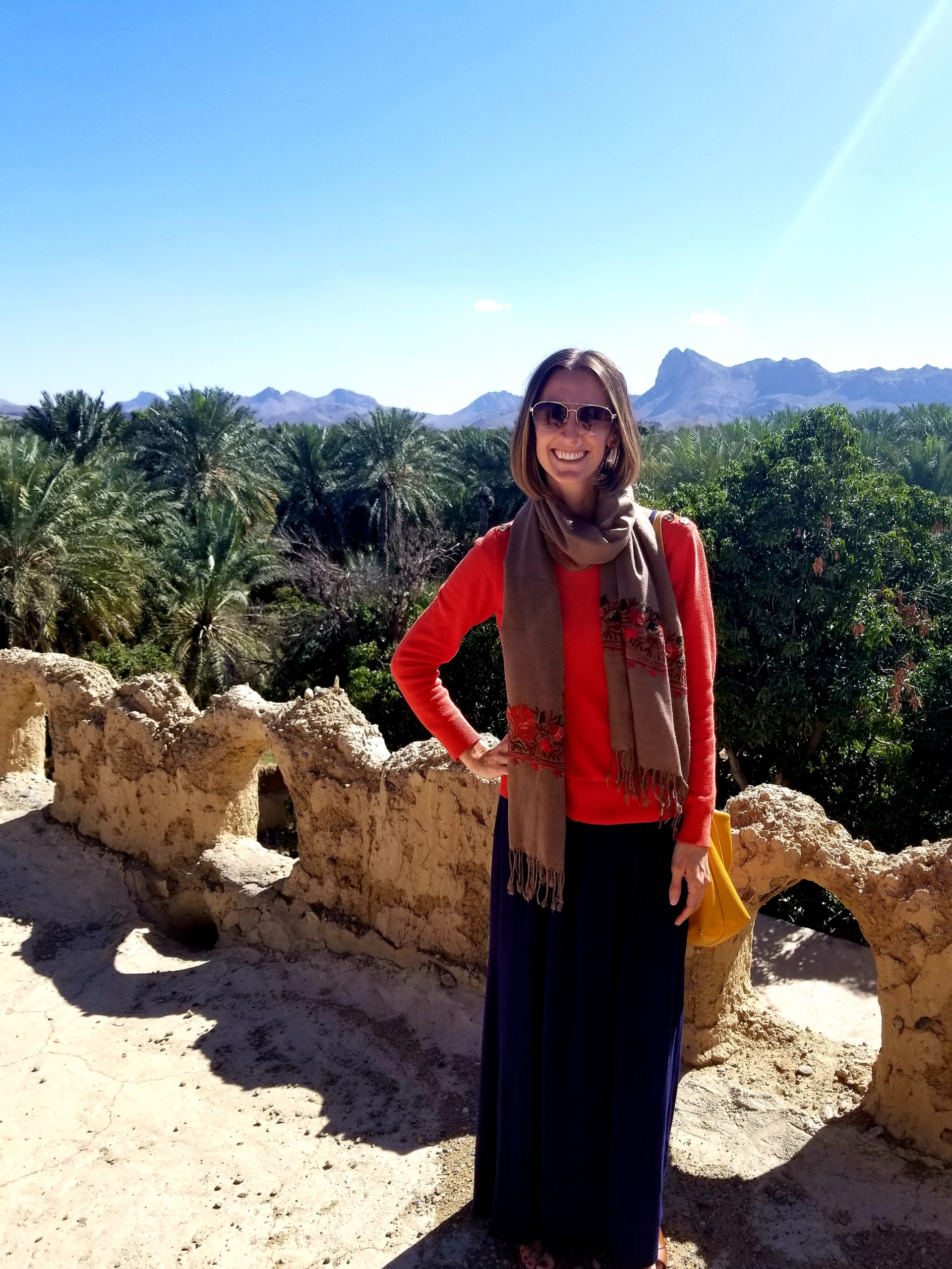 Dr. Rebecca Glazier on a city wall in the old city of Misfah.
