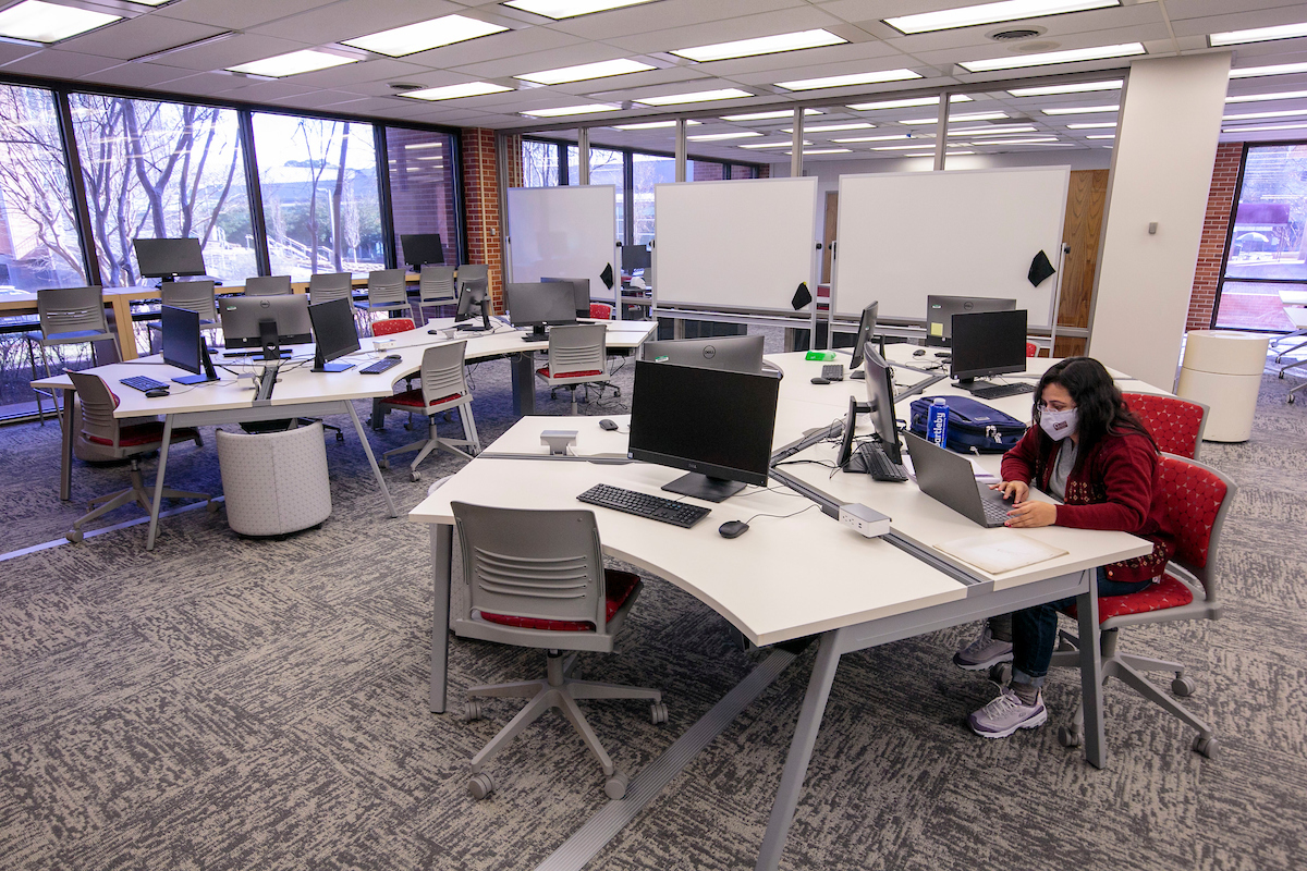 A student studies in the new Learning Commons at Ottenheimer Library.