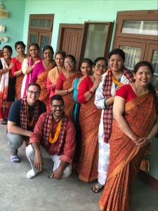 Professors Julien Mirivel and Avinash Thombre meet with villagers in the Chitwan region of Nepal during their research into Heifer International.