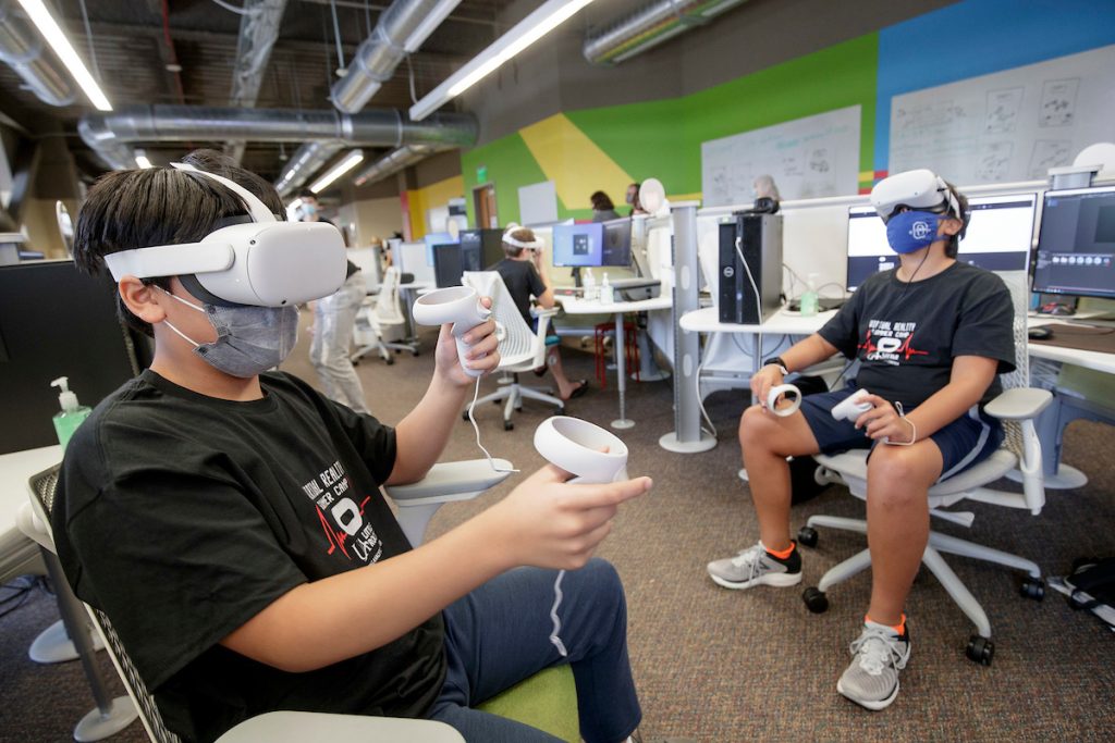 Middle school students participate in a UA Little Rock Virtual Reality Summer Camp at the Emerging Analytics Center on campus. Photo by Ben Krain.