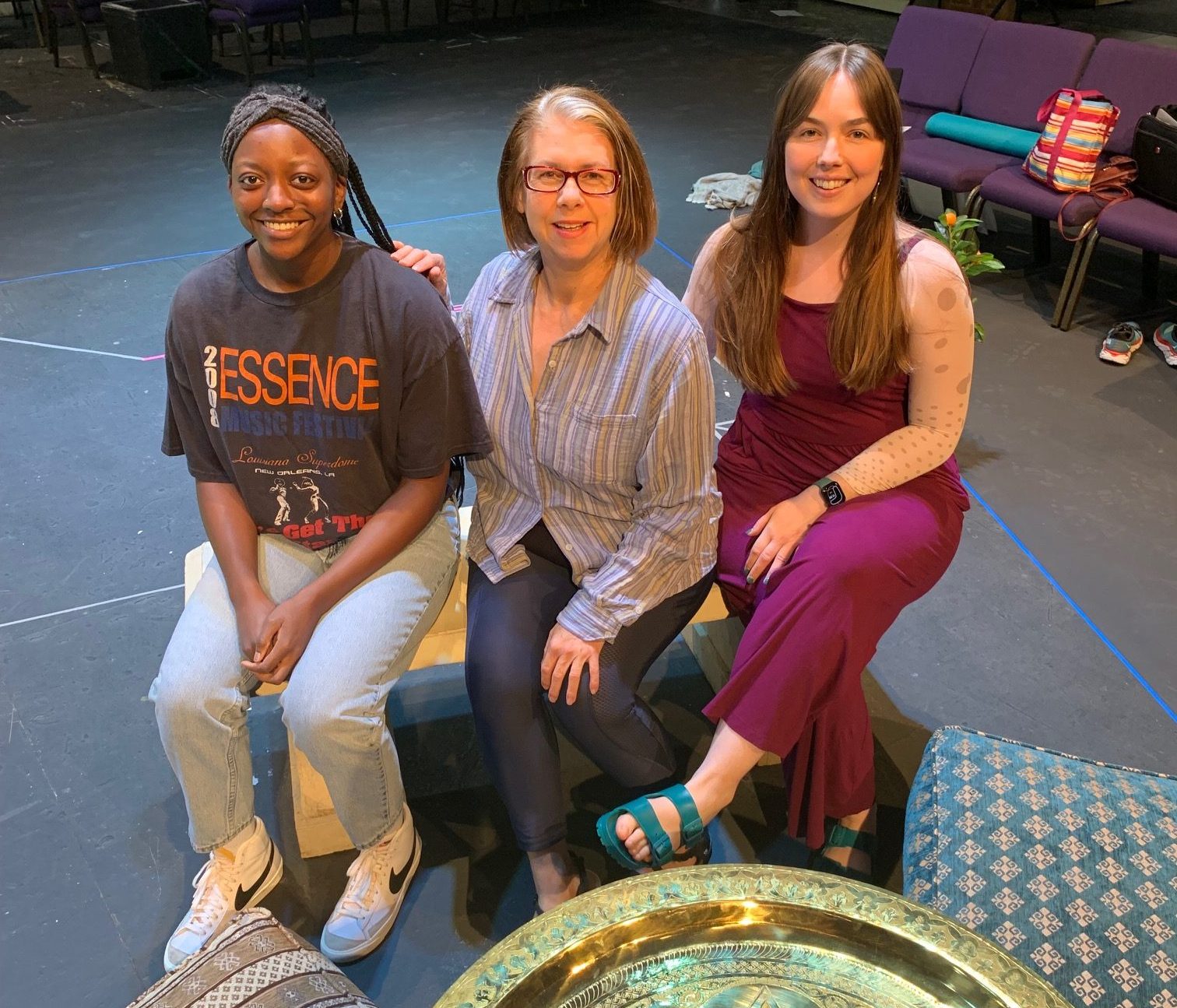 Essence Robinson, Stacy Pendergraft, and Katie Greer gather in the rehearsal room for "Much Ado About Nothing."