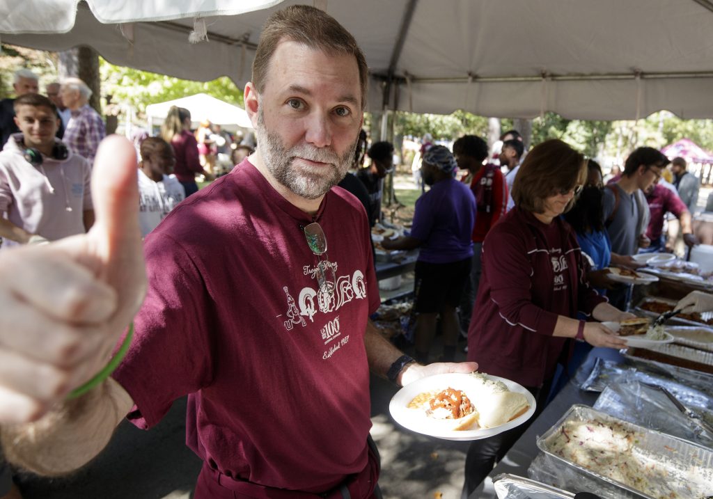 Director of Athletics George Lee enjoys some great barbecue from Whole Hog Cafe during BBQ @ Bailey on Oct. 14 at the Bailey Alumni and Friends Center. Photo by Ben Krain.