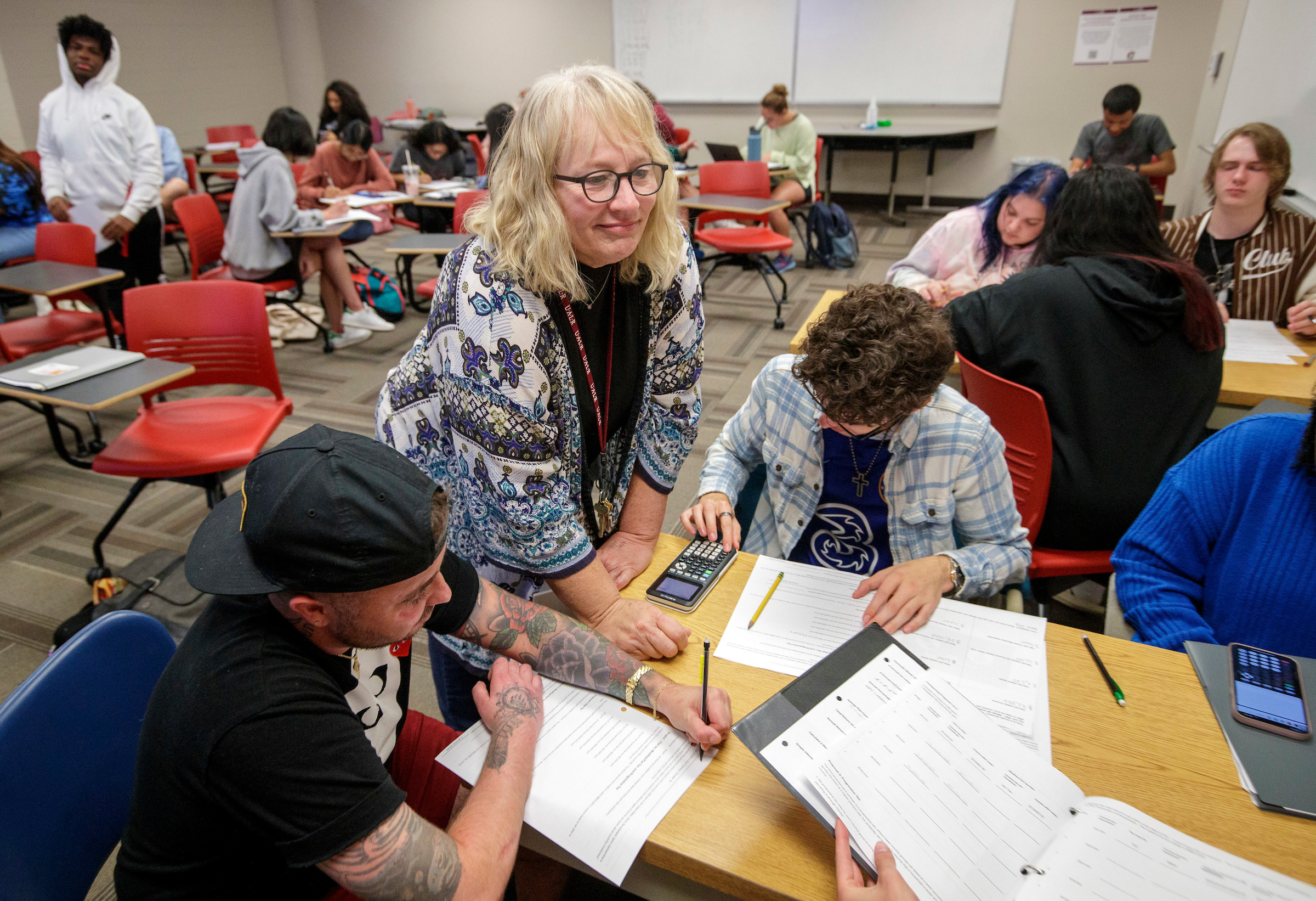 Melissa Hardeman, a senior instructor in the Department of Mathematics and Statistics, works with math students in the classroom. Photo by Ben Krain.
