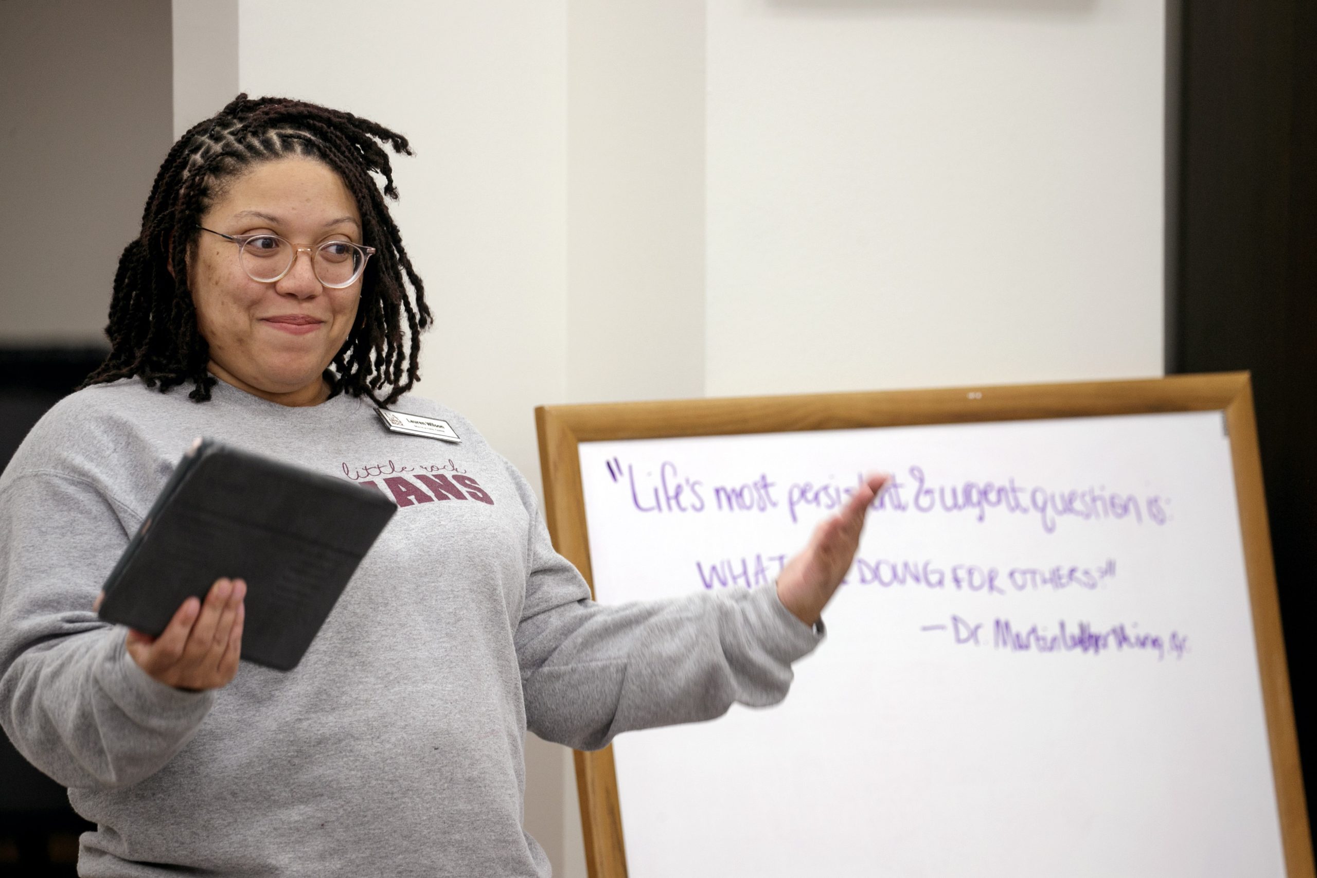 Lauren Wilson, director of the UA Little Rock Multicultural Center., poses a question to students from a Dr. Martin Luther King Jr. quote during an MLK Day of Service event.