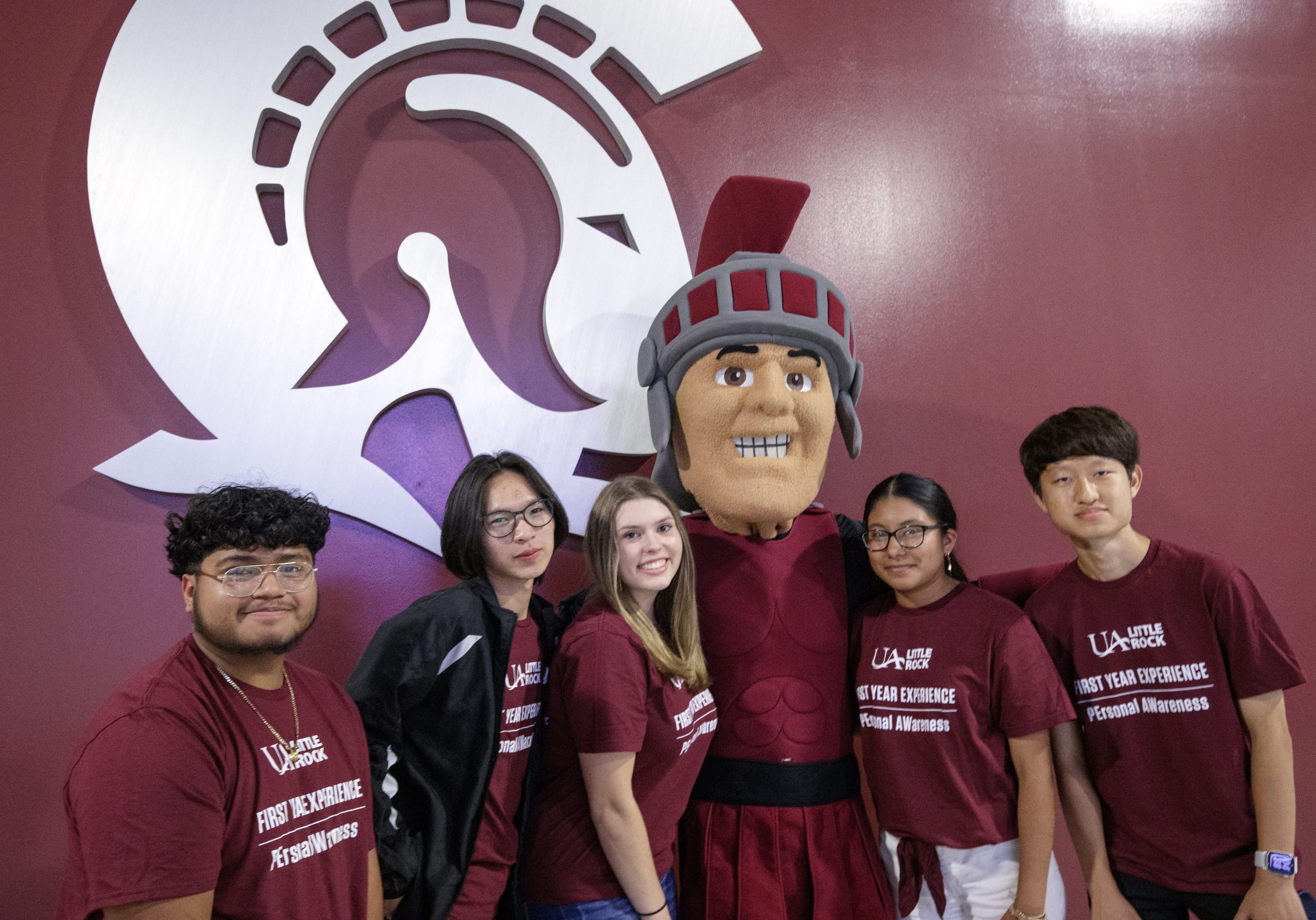 First Year Experience students in the PEAW Personal Awareness program participate in group picture day with the Trojan mascot at the Jack Stephens Center. Photo by Ben Krain.