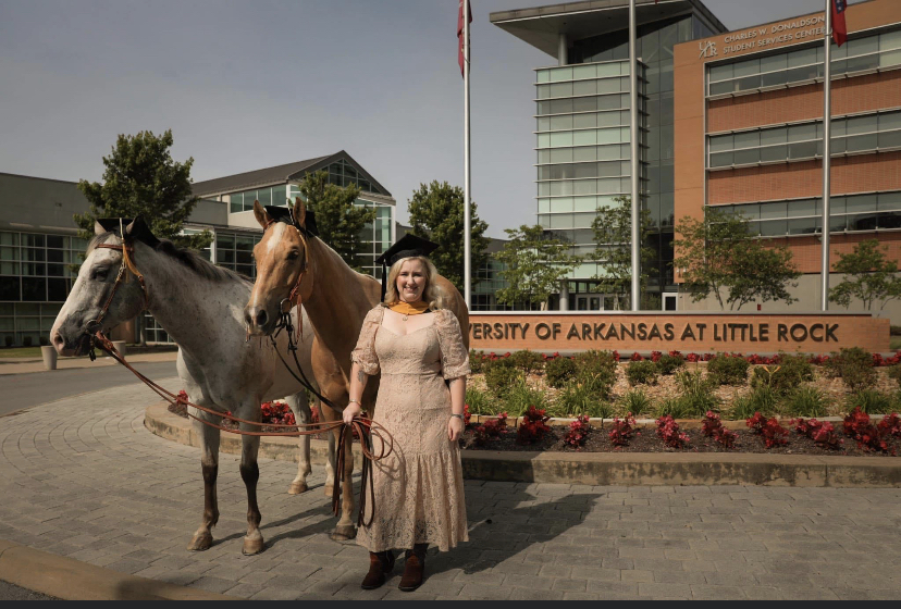 UA Little Rock graduate Bethann Coldiron Coldiron took graduation photos with her horses: Louis, a seven-year-old Palomino, and Monty, an eight-year-old Appaloosa. Photo by Kayla Weiglein.