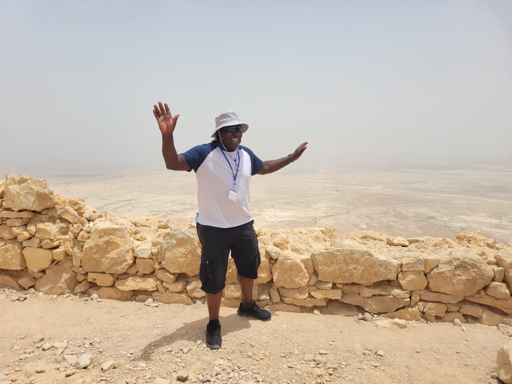 Dr. Joseph Otundo visits Mount Masada in Israel, which is known for the palaces and fortifications of Herod the Great.