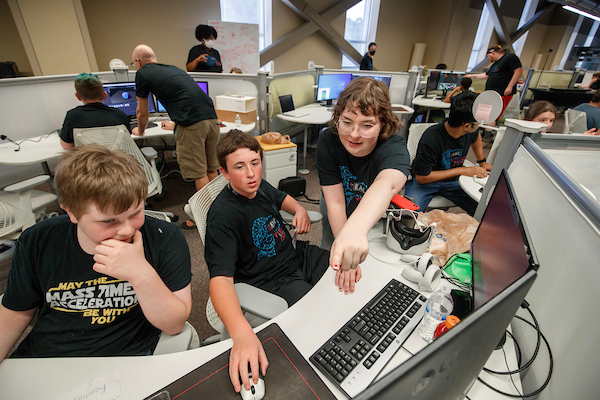 Middle school students participate in a UA Little Rock Virtual Reality Summer Camp at the Emerging Analytics Center. Photo by Benjamin Krain.