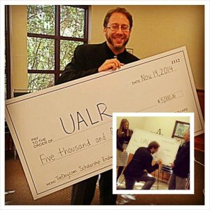 Travis “Tre’ Day” Rowan donates money to his UA LIttle Rock scholarship fund for mass communication students. 