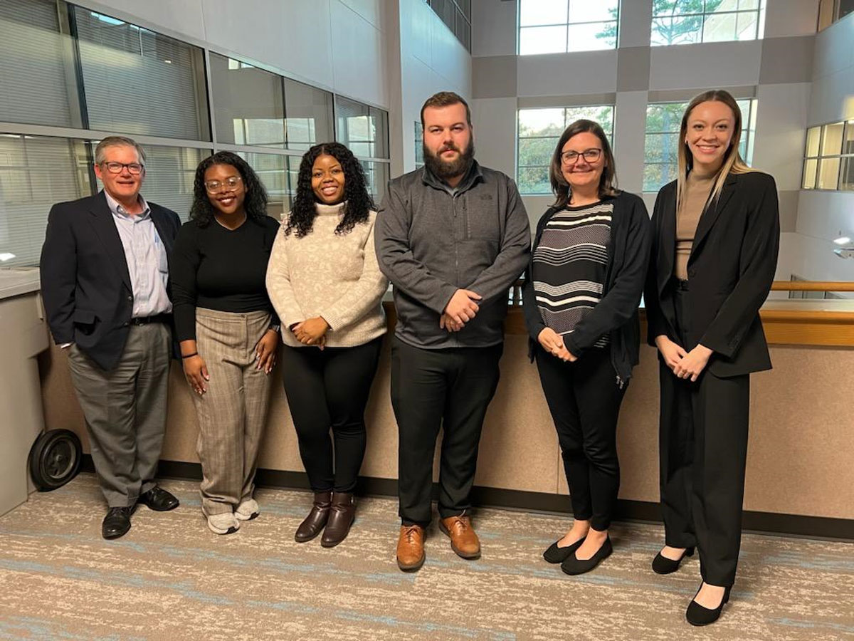 Ciara Massey and Leila Horsman, UA Little Rock students who won the Penske Sales Competition, stand with the Penske team members Patrick Quirk, Racheal Shoriwa, Cody Sparlin, and Cari Britt.