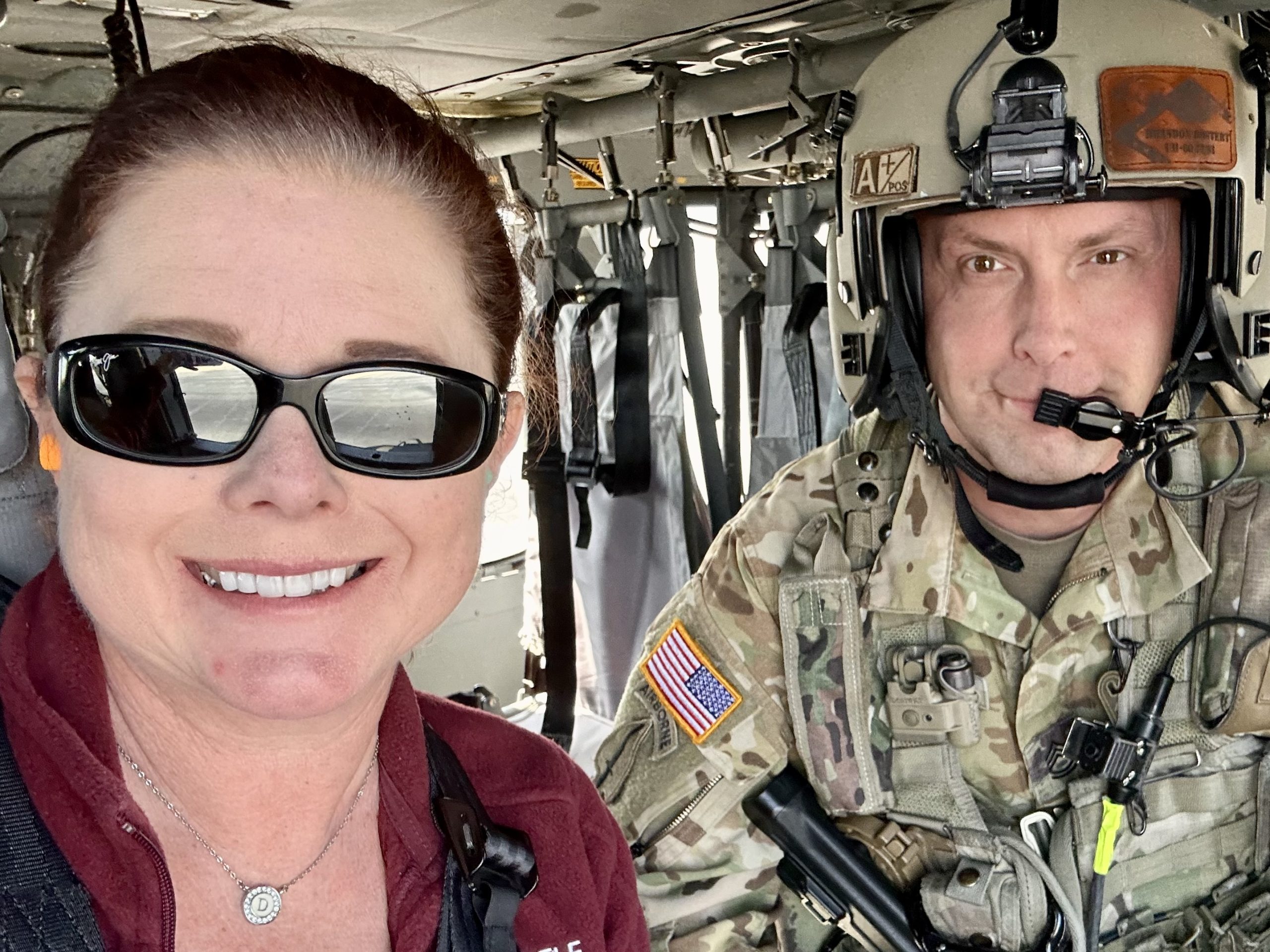 Dr. Sloan Davidson goes on a helicopter ride with Sergeant First Class Brandon Dostert during an Employer Support Boss Lift event.