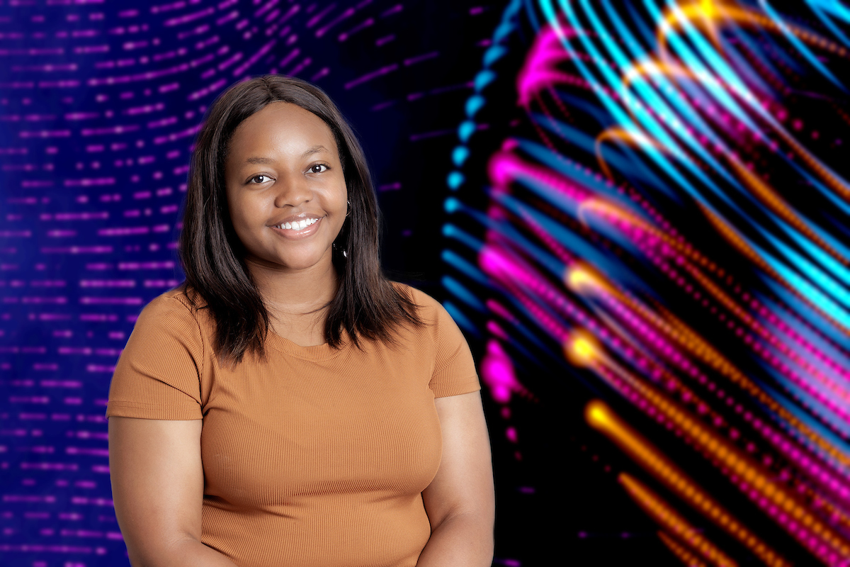 Ola Mbila-Uma is graduatiing in Spring 2024 with a master's degree in information science and conducts research in Dr. Nitin Agarwal's COSMOS group. Photo by Benjamin Krain.