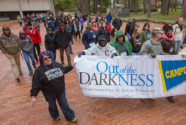 UA Little Rock employees, students, alumni, and community members participate in the Out of the Darkness Campus Walk to prevent suicide. Photo by Ben Krain.