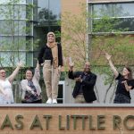 Graduating Doctoral Student Ronia Kattoum is surrounded by her colleagues at the University of Arkansas at Little Rock. Photo by Ben Krain.