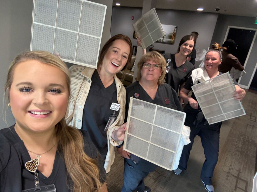 A group of UA Little Rock nursing students clean air filters while volunteering at Ronald McDonald House in Little Rock. 