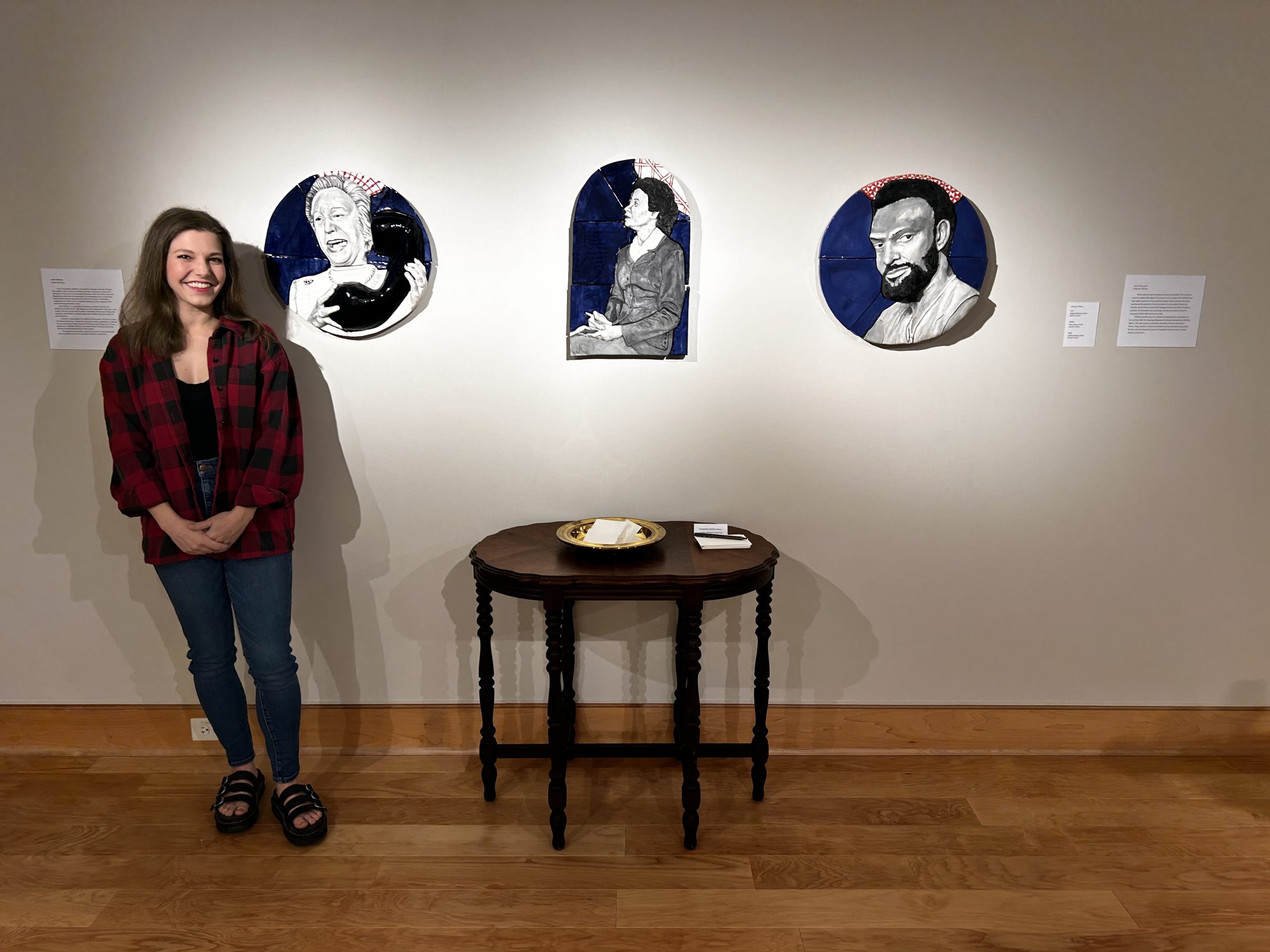 Courtney Wilson, a member of the new cohort of artLAUNCH recipients at UA Little Rock, is shown with some of her artwork.