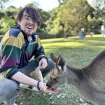 Adrian Rogers feeds a kangaroo at the Lone Pine Koala Sanctuary while studying abroad in Australia.