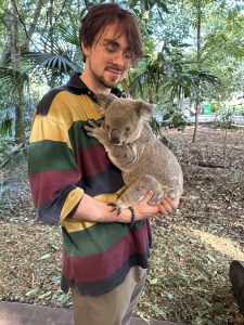 Adrian Rogers visits with a koala at the Lone Pine Koala Sanctuary while studying abroad in Australia. 
