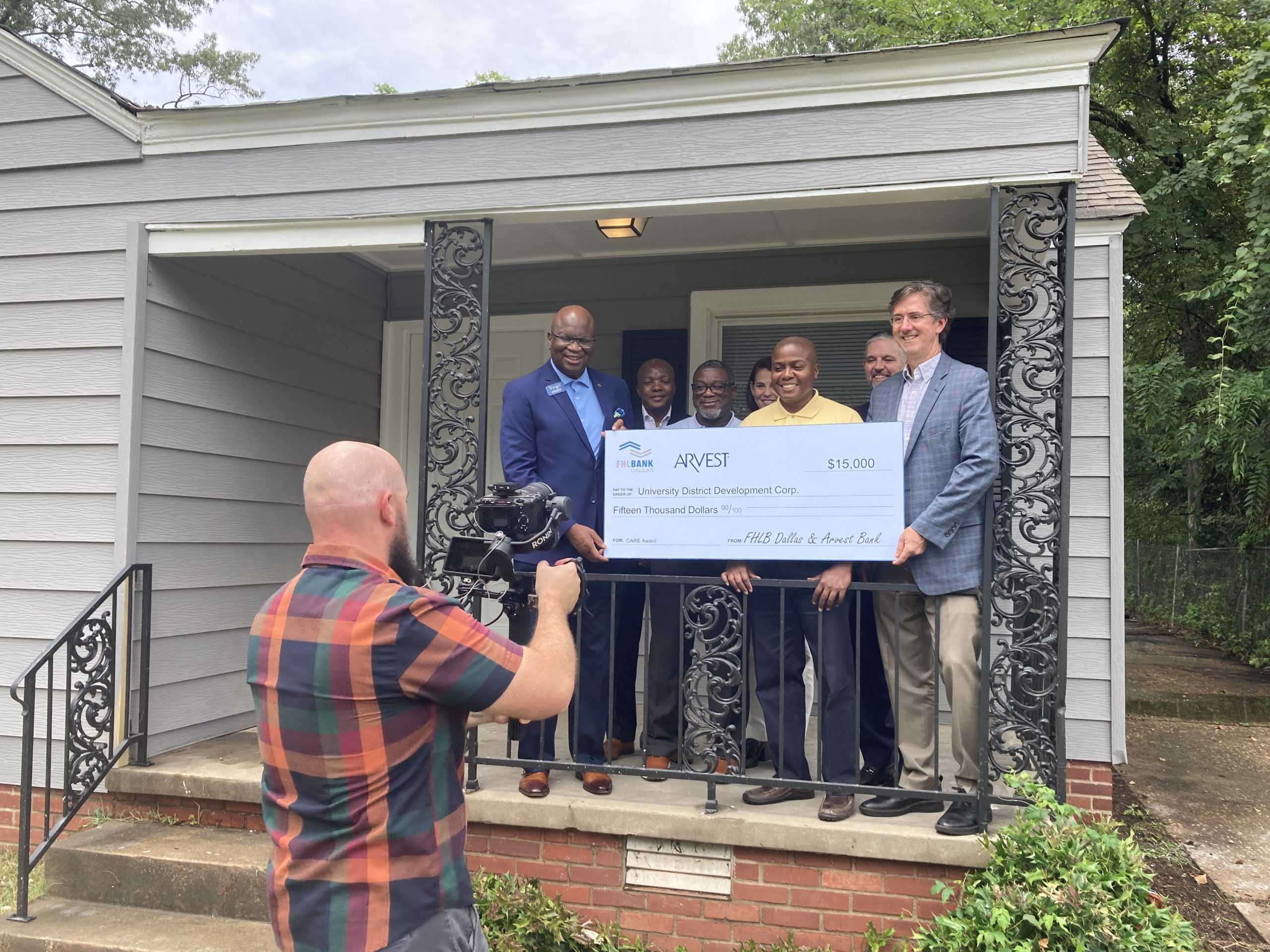 Representatives from Arvest Bank and the Federal Home Loan Bank of Dallas present a $15,000 donation to the University District Development Corporation, which was used to renovate a home in Little Rock’ Midtown Neighborhood. Those pictured, from left to right, include Virgil Miller, group CRA director of Arvest Bank; Bruce Hatton, community marketing and outreach manager for FHLB Dallas; Quincy Edwards, housing development manager for University District Development Corporation; Hillis Schild, executive director of Arvest Opportunity Fund and University District Development Corporation board member; Barrett Allen, executive director of University District Development Corporation; Ron Witherspoon, president of Arvest Bank-Central Arkansas; and Greg Hettrick, senior vice president and director of community investment for FHLB Dallas.