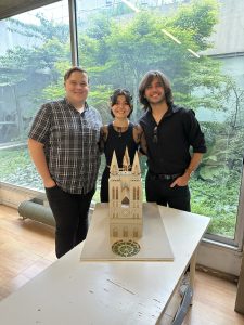 Adison Cummings, left, and his teammates are shown with their replica of Notre Dame. 