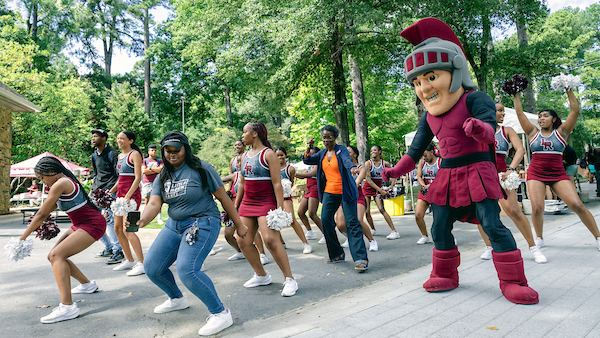 Maximus joins the UA Little Rock Dance team for a lively performance at BBQ at Bailey on Sept. 24. Photo by Beatriz Garcia.