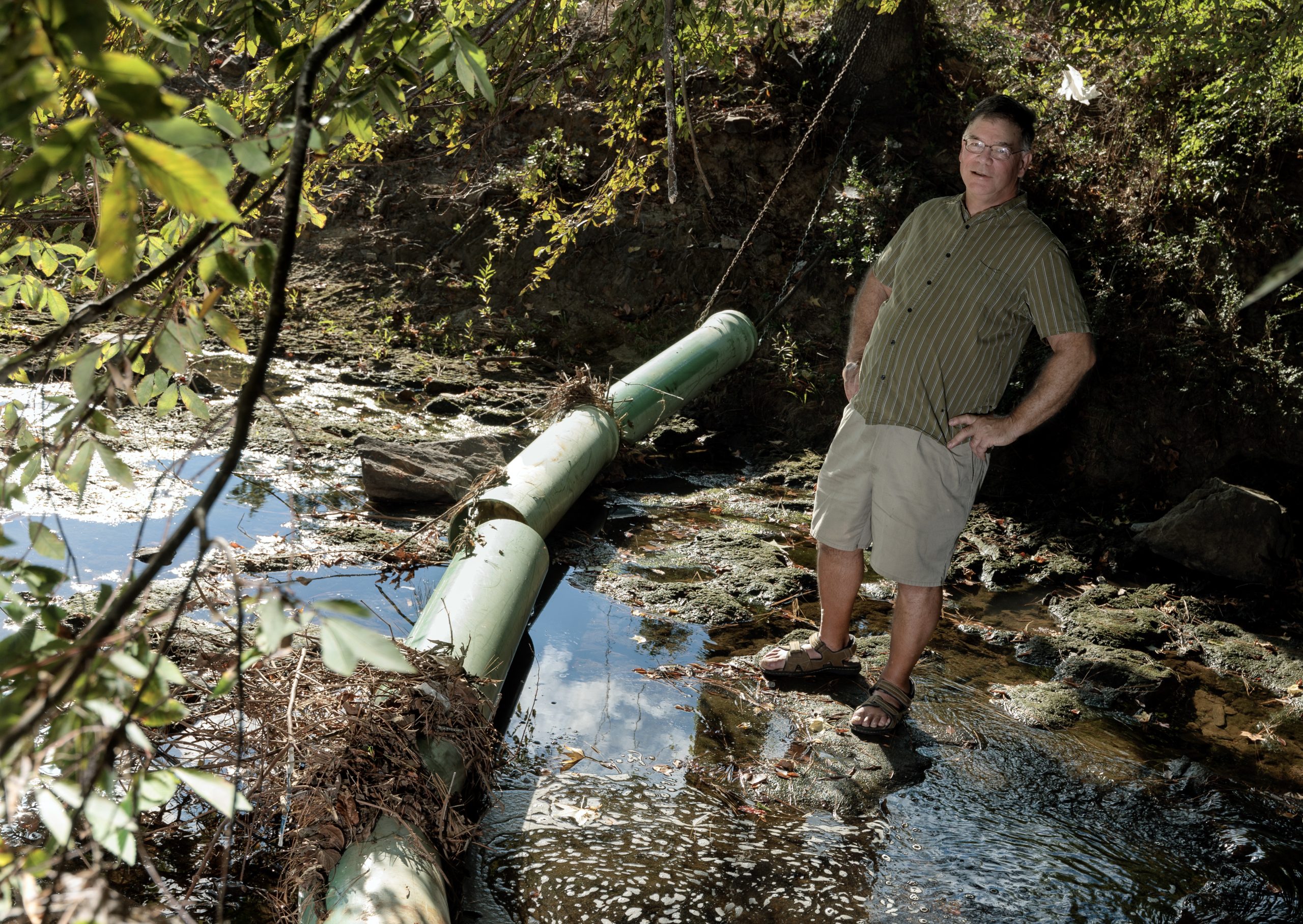 Dr. John Czarnecki, an adjunct professor of geology, built and installed this trash boom to help keep Coleman Creek clean. Photo by Benjamin Krain.