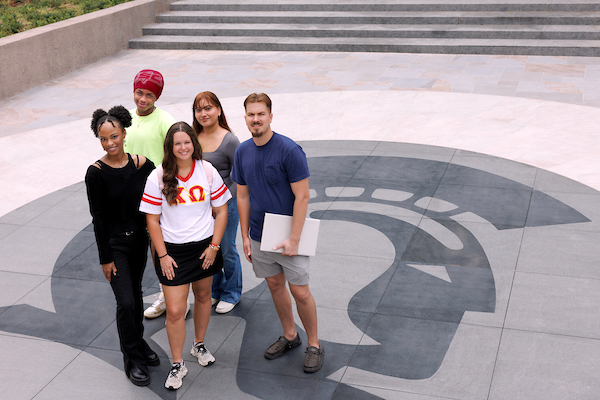 UA Little Rock students enjoy a walk along Trojan Way during the Fall 2024 semester. Photo by Benjamin Krain.