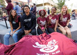 UA Little Rock students enjoy their new t-shirts celebrating the completion of Trojan Way. Photo by Benjamin Krain.