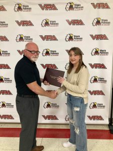 Dr. Hank Bray, chair of the Department of Construction Management and Civil and Construction Engineering at UA Little Rock, congratulates Madison Finch on earning her associate degree.