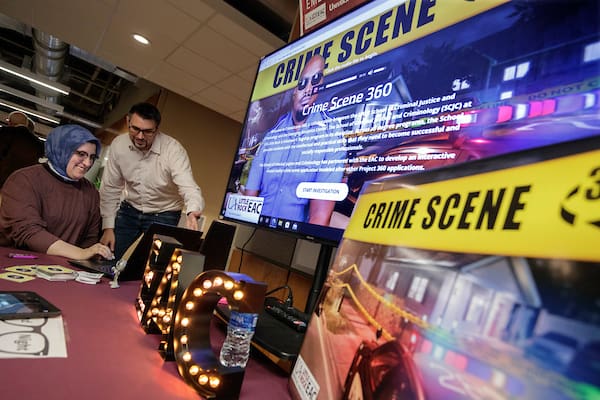 Visitors check out the research opportunities available in the Donaghey College of STEM during Nerd Night. Photo by Ben Krain.
