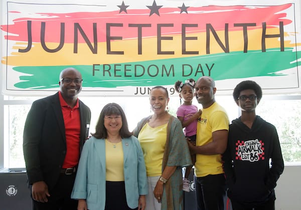 Dr. Melvin Beavers, Chancellor Christina Drale, former Senator Joyce Elliot, Senator Fred Love and his daughter and son attend the 2023 Juneteenth celebration at UA Little Rock. Photo by Benjamin Krain.