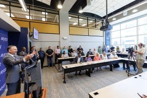 Ron Witherspoon, community bank president for Arvest Central Arkansas, speaks about the importance of investing in facilities for business education. Photo by Benjamin Krain.