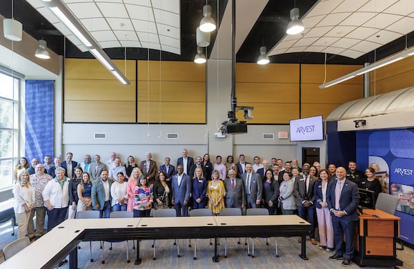 UA Little Rock faculty, staff, students, and guests participate in a classroom dedication ceremony of the newly renovated Arvest Classroom in the School of Business. Photo by Benjamin Krain.