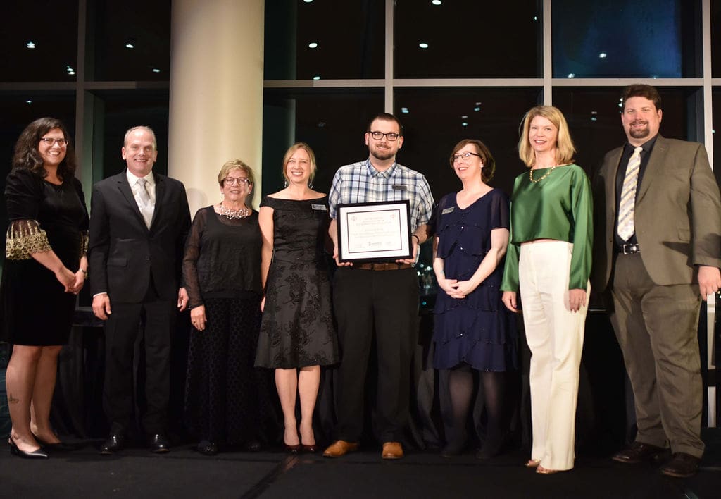 UA Little Rock receives the Outstanding Achievement in Preservation Education Award. Pictured from left to right are Rachel Patton (Preserve Arkansas), Dr. Jess Porter, Dr. Deborah Baldwin, Emily Summers, James Wethington, Dr. Amanda McQueen, Laura McClellan (Arkansas Heritage), and Preserve Arkansas Board President Matthew Rooney. Photo by Stephanie Dunn King Photography.