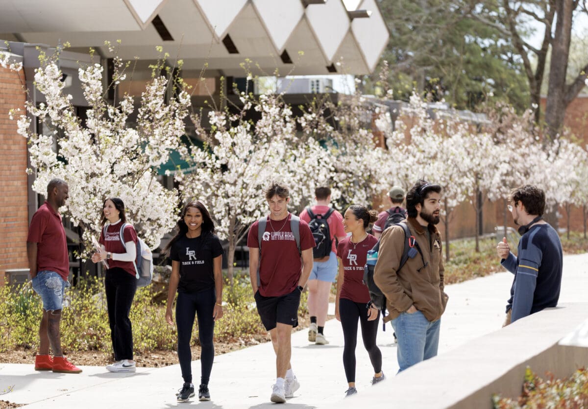 UA Little Rock students walk along Trojan Way on a beautiful day during the Spring 2025 Semester. Photo by Benjamin Krain.