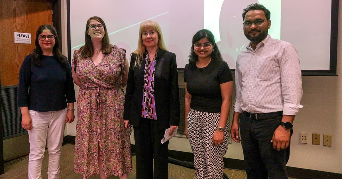 Dr. Mariya Khodakovskaya, professor of plant biology, celebrates with the students who nominated her for the university’s inaugural Mentoring Award.
