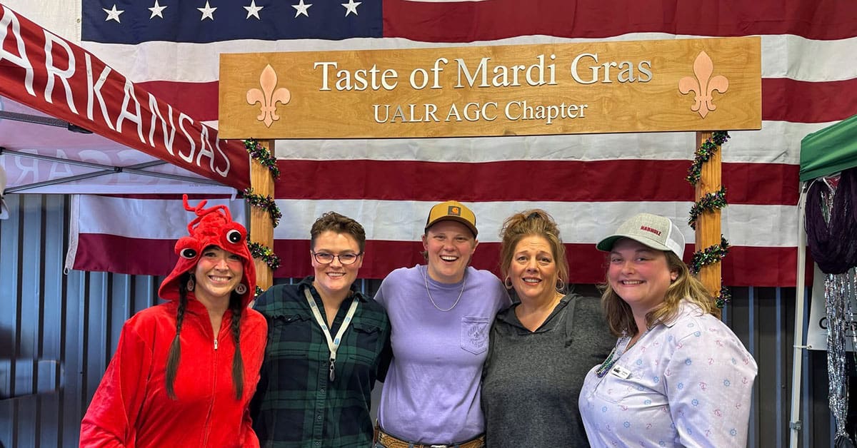 Construction management students, professors, alumni, and industry professionals celebrate during A Taste of Mardi Gras event to raise money for student scholarships and activities at UA Little Rock.
