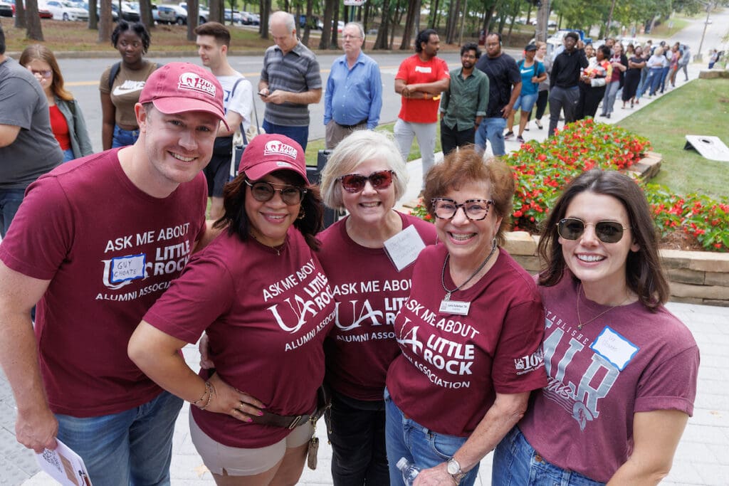 UA Little Rock board members volunteer at BBQ at Bailey. Photo by Ben Krain.