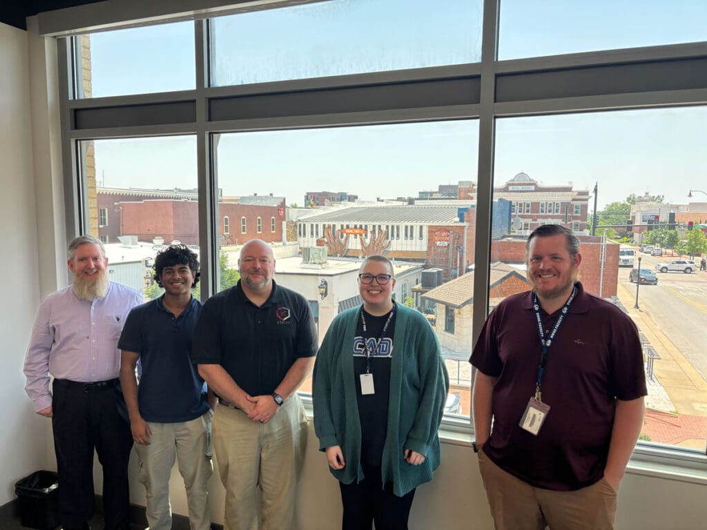 Teachers and students who interned at Bastazo over the summer include, from left to right, Matthew Possehl, Harshith Guduru, Clint Holderby, Kylie McClanahan, chief technology officer at Bastazo, and Taylor Kinsley.