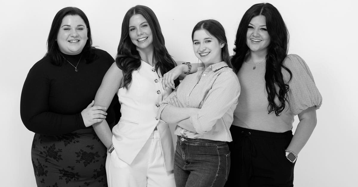 Hannah Darden (left), a professional and technical writing student at UA Little Rock, is shown with her fellow interns at CJRW.