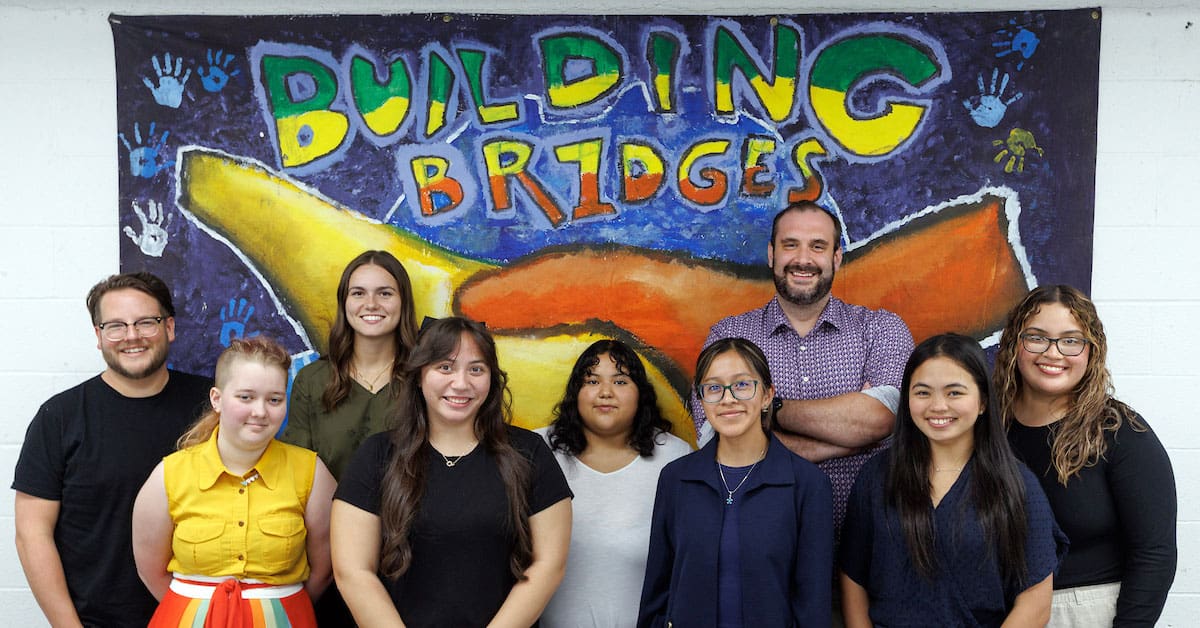 Summer interns at Seis Puentes meet with the new fall cohort to share insights about working with the nonprofit, where UA Little Rock students assist with client services, events, and community outreach. From left are Raul Fernández, Jasper Kline, Ragen Hodge, Louise Hobby, Lizbeth Rentería, Liliana Grace Vallejo, Dr. Rex Wilkins, Dhen Shirley Terre, and Jennifer Camacho. Photo by Ben Krain.