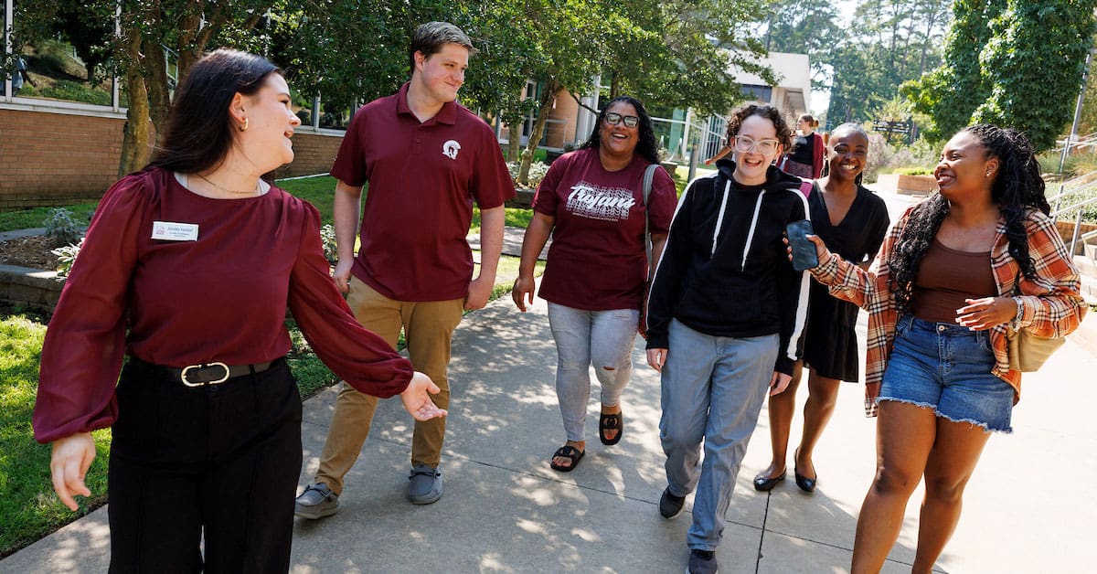 A UA Little Rock student leads a group on a tour of campus during the fall 2025 semester. Photo by Benjamin Krain.