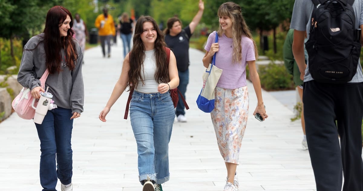 Students walk across the new Trojan Pathway