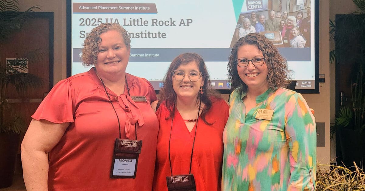 Dr. Monica Meadows, left, and Krystal Nail, right, of the Arkansas Department of Education welcome a teacher to her first Advanced Placement Summer Institute at the University of Arkansas at Little Rock.
