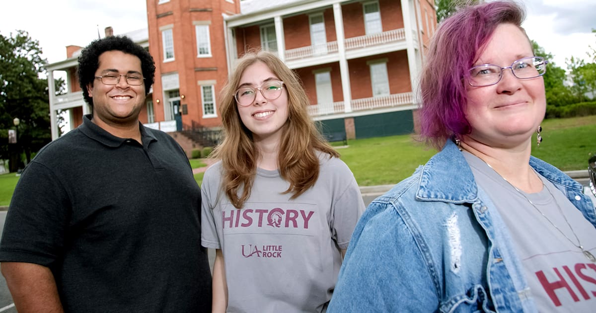UA Little Rock history students pose at historic MacArthur Museum of Arkansas Military History.