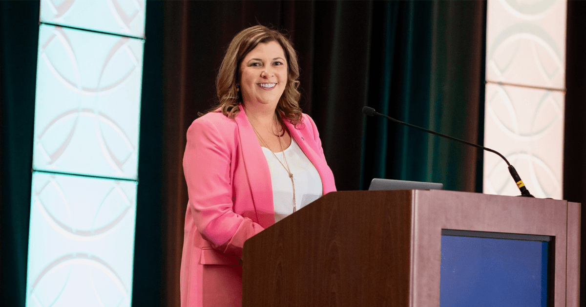 Dr. Carrie Phillips speaks at a past CASE District IV Conference. She concludes her four-year term as district chair on June 30.