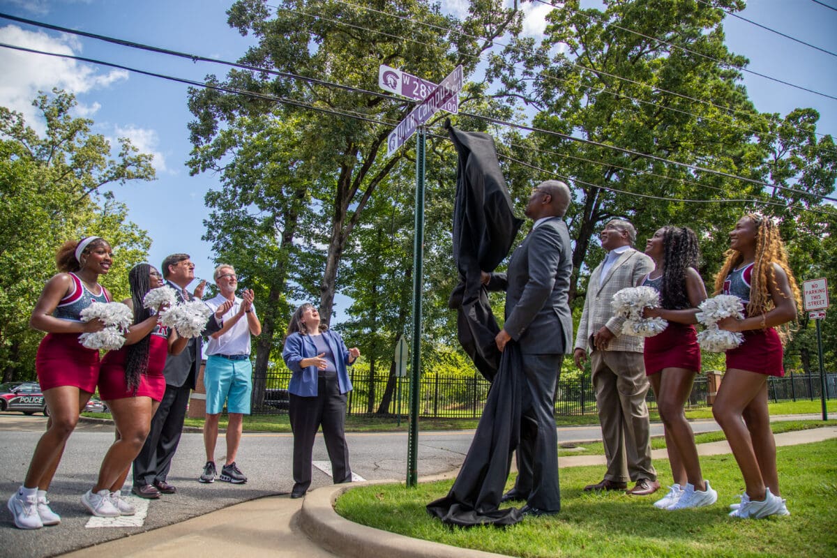 Frank Scott Jr., mayor of Little Rock, officially unveils new custom street signs for the University of Arkansas at Little Rock July 16.