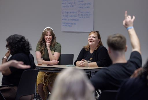 Award winning teachers Stephanie Williams and Brandi De La Cruz talk to members of the Trojan Teacher Residency Program.